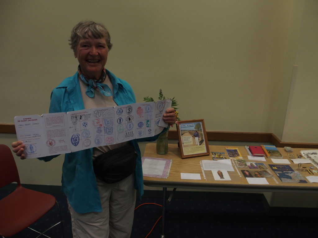 Doris Haynes holds up her book of stamps
